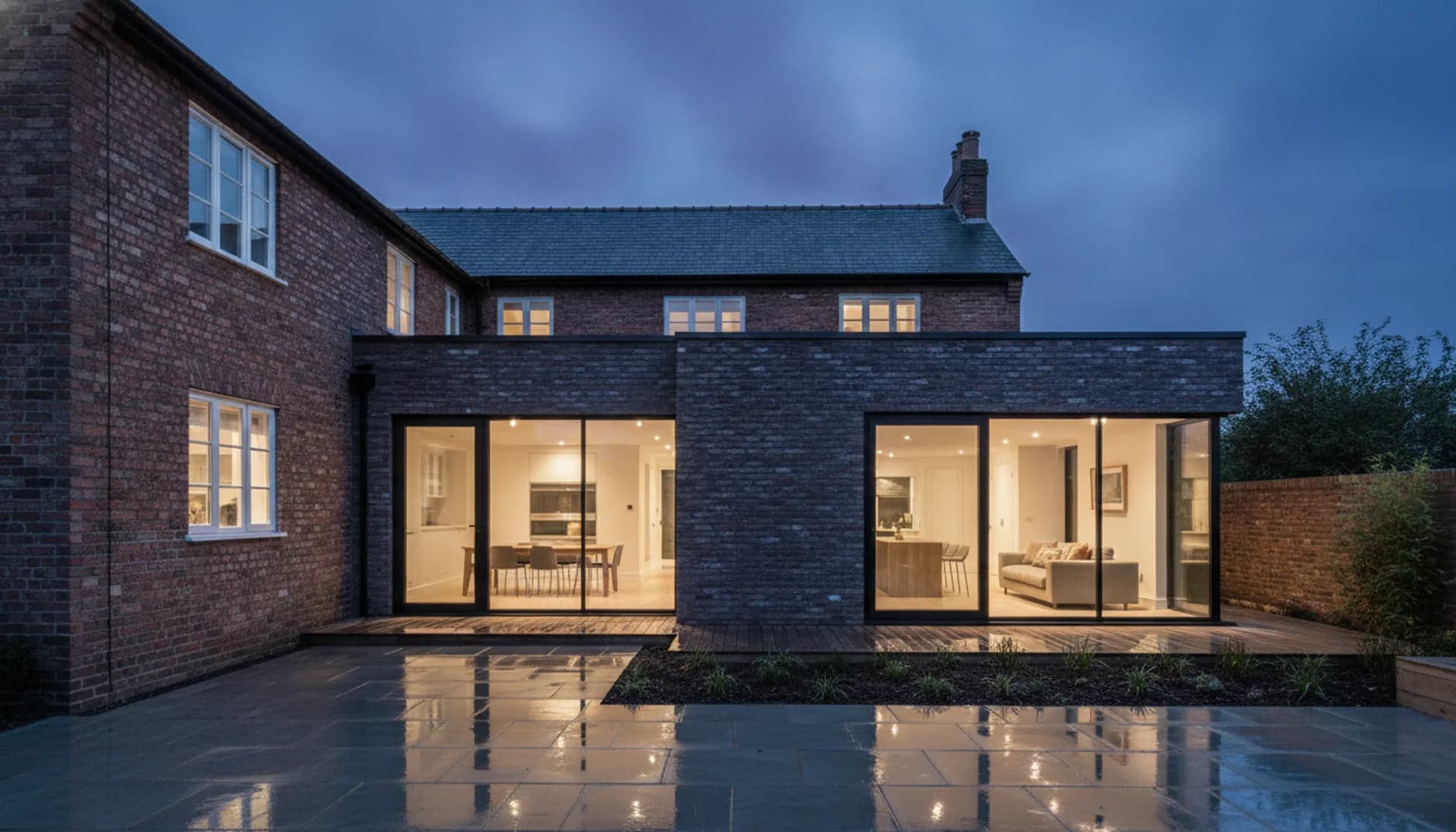 Modern house extension with black-framed glazing, illustrative example